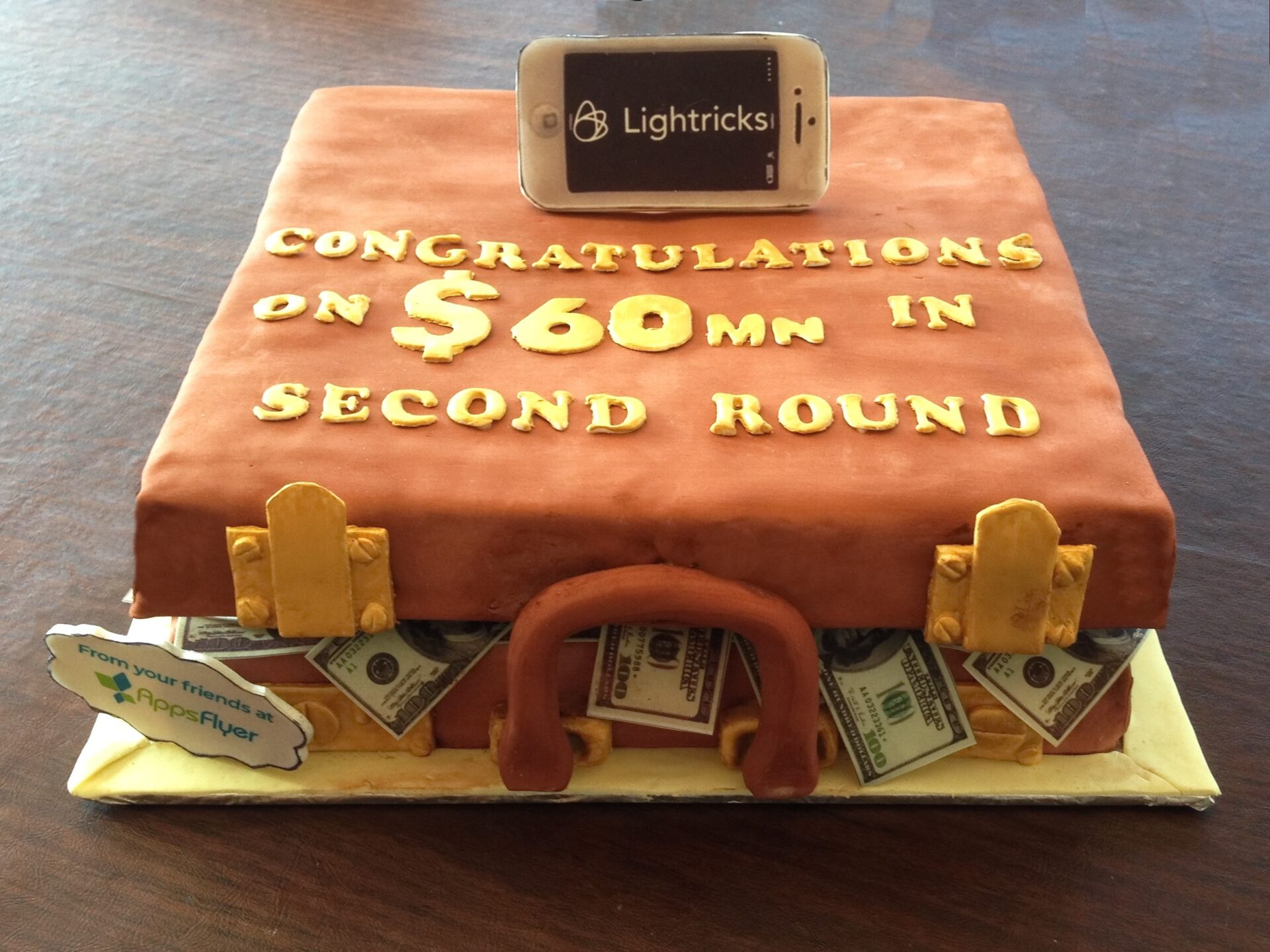 leather briefcase cake with money spilling out sides