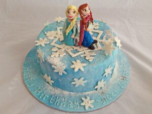 snowflake winter cake with sisters